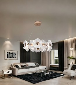 Modern living room with a decorative chandelier, sofa, and coffee table.