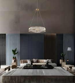 Modern living room with a pendant light, sofa, and decorative elements.