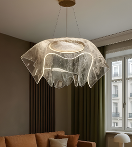 Modern pendant light fixture in a living room setting with a window in the background.