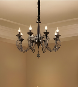 Chandelier hanging from the ceiling in a room with beige walls.