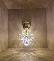 Decorative wall light fixture with crystal design in a neutral setting