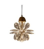 Gold pendant light fixture hanging from a ceiling