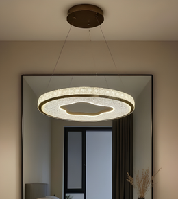 Modern ceiling light fixture in a room with a mirror and decorative elements.