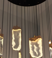 Decorative pendant lights with a textured design on a neutral background
