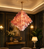 Elegant rose petal Capiz chandelier illuminating a luxury living room with warm ambient glow