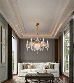 Gold crystal chandelier with clear decorative drops and candle-style lights displayed above an elegant white sofa in a luxury living room.