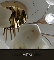 A close-up of a modern ceiling light fixture with sculptural white calla lily-shaped shades and metallic bronze arms, viewed from below against a white ceiling. A dark banner at the bottom reads 'METAL'.