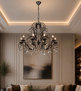 Black decorative crystal chandelier suspended above a luxury living room with neutral furnishings, framed wall panelling, and warm ambient lighting.