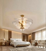 Glass petal pendant chandelier illuminating an elegant contemporary interior.