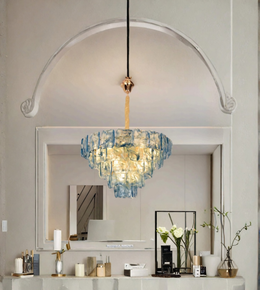 Blue sculptural glass chandelier illuminating a contemporary luxury living space.
