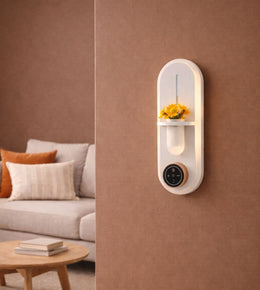 Smart ambient wall light with aroma diffuser, flower holder, and touch controls creating warm halo lighting