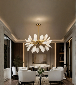 A large, modern flower-shaped chandelier with white petal-like shades and a gold central frame hangs in a luxurious, contemporary living room with white armchairs and warm ambient lighting.