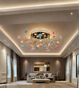 A modern ceiling light fixture with gold-toned branches and pastel pink and blue flower-like accents, installed in a contemporary living room with warm recessed lighting.