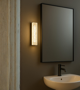 Bathroom setting with a mirror, light fixture.
