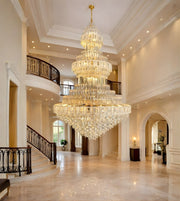 Grand emperor tiered glass crystal chandelier in a palatial double height foyer