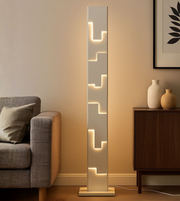 Modern LINEA STEPS LED floor lamp by Daya Worldwide featuring sleek design and adjustable lighting for contemporary spaces.