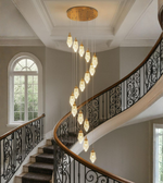 Cascading crystal chandelier for double-height staircase with gold finish