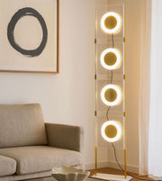 Modern LED ring floor lamp with circular lights in contemporary living room