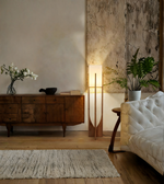 Modern wooden floor lamp illuminating a living room interior