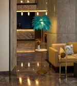 Teal ostrich feather floor lamp with side table in luxury lobby setting