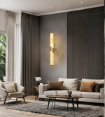 Elegant marble-finish wall lamp enhancing a modern sofa backdrop
