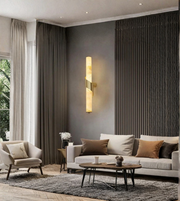 Elegant marble-finish wall lamp enhancing a modern sofa backdrop