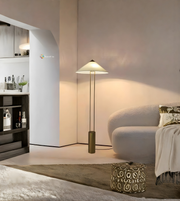 Modern cone shade floor lamp with metal base in minimalist living room