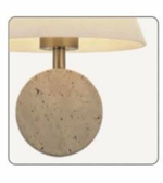 Wall-mounted light fixture with round concrete base and gold finish