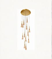 Gold pendant light fixture on a white background