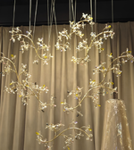 Decorative crystal branches hanging against a curtain backdrop