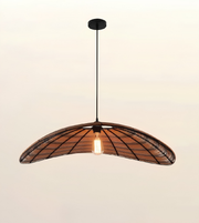 Modern woven dome pendant light with black metal frame and natural woven shade, ideal for dining rooms, cafés, restaurants, and contemporary interiors.
