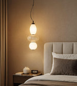 Daya Worldwide ORBLINE pendant light hanging with a sleek, modern design and warm ambient lighting.