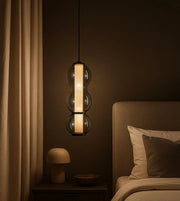 Daya Worldwide ORB GLOW Pendant hanging fixture with a sleek, modern design and warm ambient lighting.