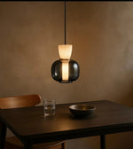 Modern pendant light fixture from Daya Worldwide's GLOWPOD collection, featuring sleek design and warm illumination.