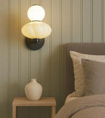 Daya Worldwide ORBA wall light mounted on a wall, showcasing its modern design and sleek fixture for premium lighting decor.