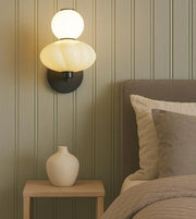 Daya Worldwide ORBA wall light mounted on a wall, showcasing its modern design and sleek fixture for premium lighting decor.